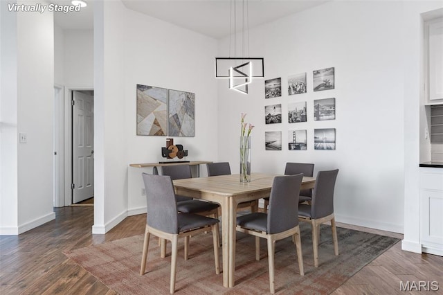 4570 Laclede Ave Unit 301, Saint Louis, MO 63108 - dining space featuring wood finished floors and a high ceiling