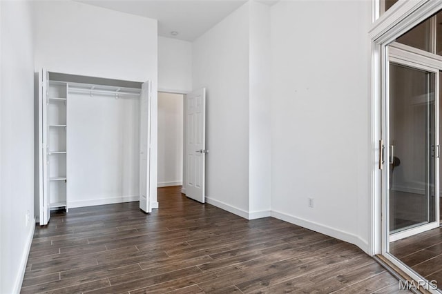 4570 Laclede Ave Unit 301, Saint Louis, MO 63108 - unfurnished bedroom with dark wood-type flooring and a closet