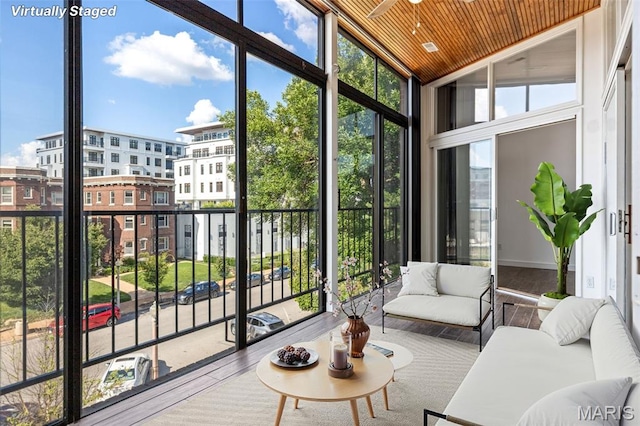 4570 Laclede Ave Unit 301, Saint Louis, MO 63108 - sunroom featuring a ceiling fan, plenty of natural light, outdoor lounge area, and vaulted ceiling