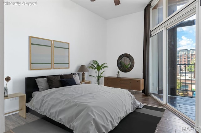 4570 Laclede Ave Unit 301, Saint Louis, MO 63108 - bedroom with access to exterior and wood finished floors