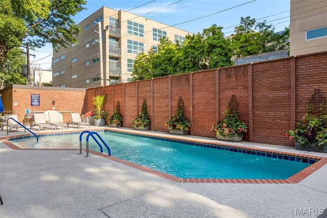 4570 Laclede Ave Unit 301, Saint Louis, MO 63108 - view of swimming pool with a fenced backyard and a patio area