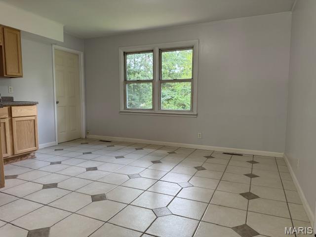618 Houston Rd, Rolla, MO 65401 - unfurnished dining area with baseboards