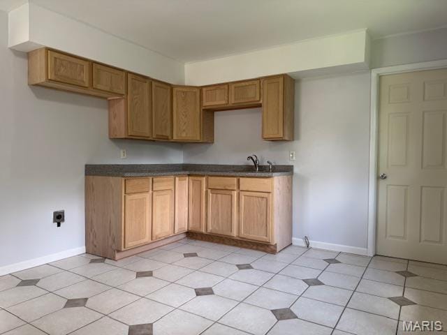 618 Houston Rd, Rolla, MO 65401 - kitchen featuring dark countertops and brown cabinetry
