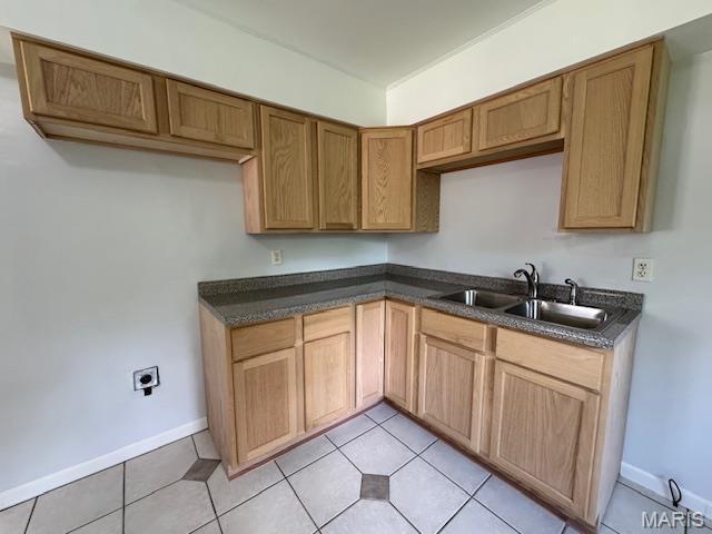 618 Houston Rd, Rolla, MO 65401 - kitchen featuring dark countertops and light tile patterned floors