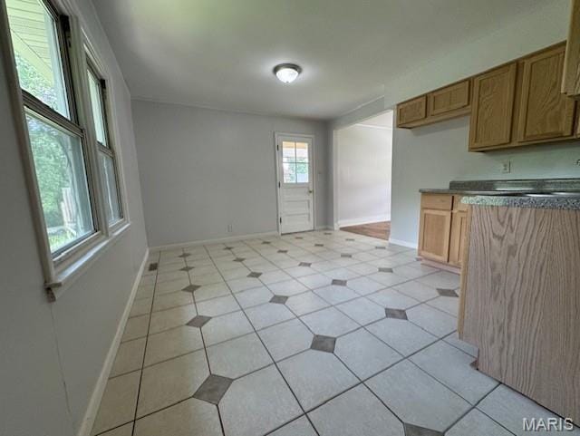 618 Houston Rd, Rolla, MO 65401 - kitchen featuring baseboards and dark countertops