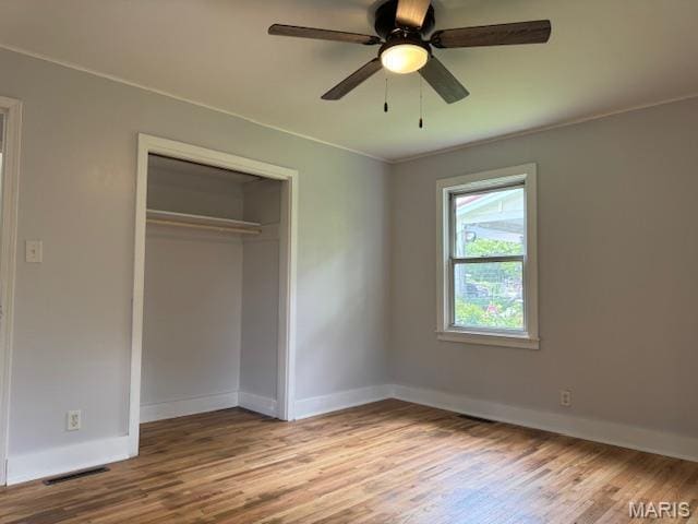 618 Houston Rd, Rolla, MO 65401 - unfurnished bedroom featuring wood finished floors, a closet, crown molding, and ceiling fan