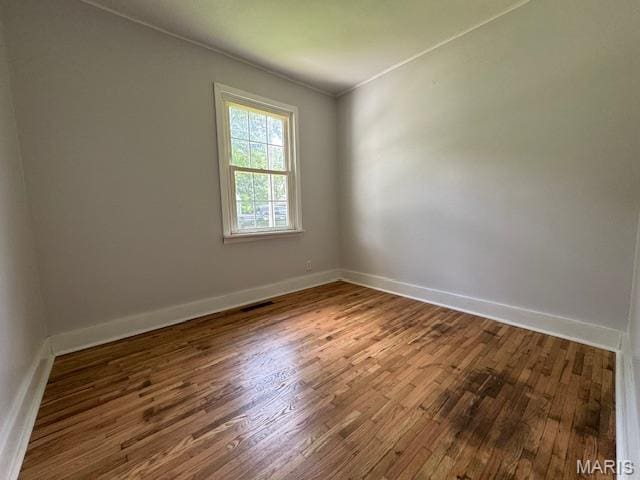 618 Houston Rd, Rolla, MO 65401 - empty room featuring wood finished floors and crown molding