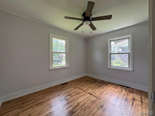 618 Houston Rd, Rolla, MO 65401 - unfurnished room with wood finished floors, ceiling fan, and ornamental molding