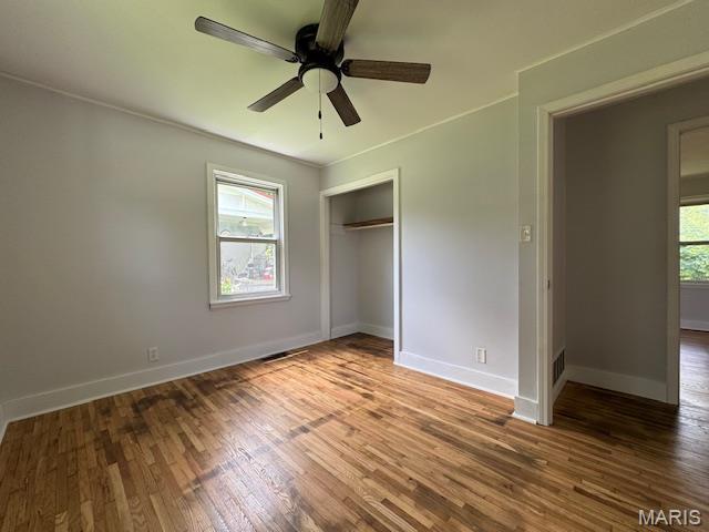 618 Houston Rd, Rolla, MO 65401 - unfurnished bedroom with wood finished floors, a closet, and ceiling fan