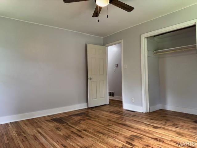 618 Houston Rd, Rolla, MO 65401 - unfurnished bedroom featuring a closet, wood finished floors, and ceiling fan