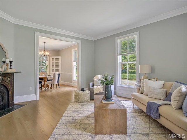 1734 Seminary St, Alton, IL 62002 - living area featuring wood finished floors, crown molding, and a chandelier