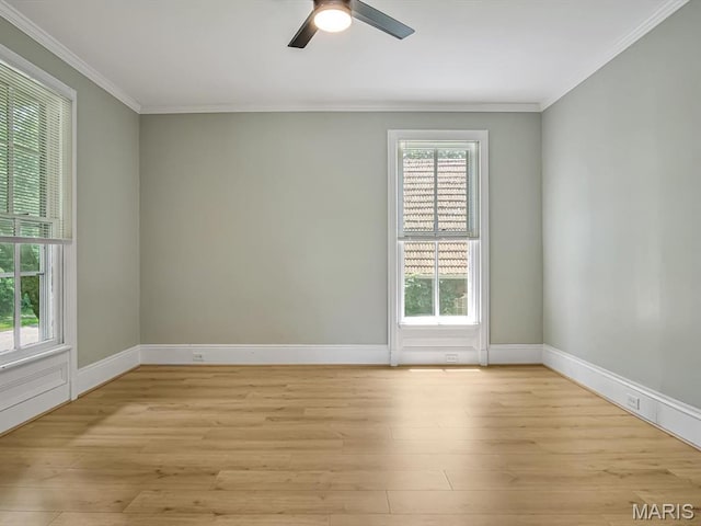 1734 Seminary St, Alton, IL 62002 - unfurnished room with healthy amount of natural light, crown molding, light wood-type flooring, and a ceiling fan