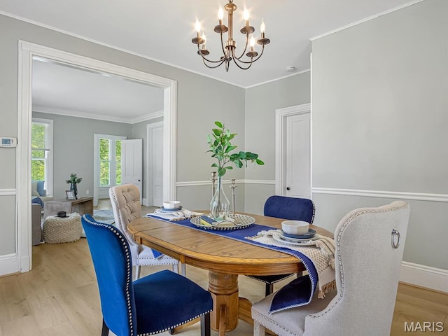 1734 Seminary St, Alton, IL 62002 - dining area with a chandelier, light wood-style flooring, and ornamental molding