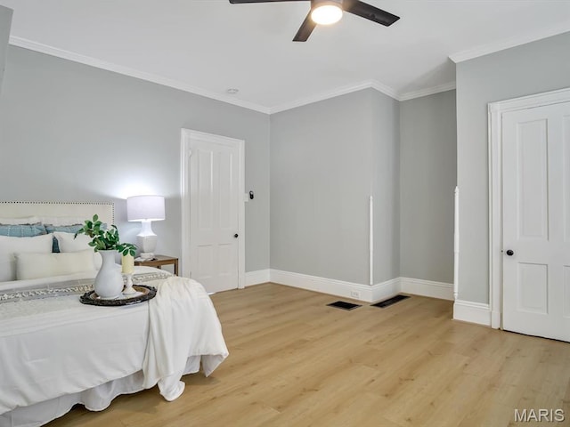 1734 Seminary St, Alton, IL 62002 - bedroom featuring light wood finished floors, ornamental molding, and a ceiling fan