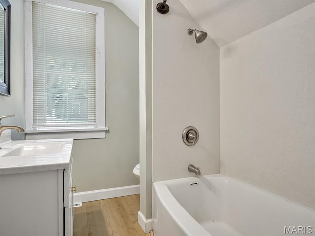 1734 Seminary St, Alton, IL 62002 - bathroom featuring vanity, lofted ceiling, wood finished floors, and shower / bathtub combination