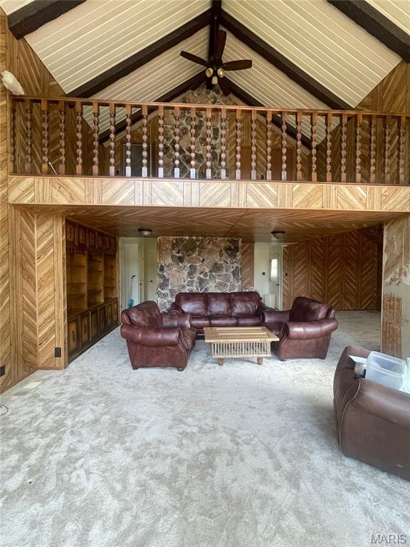 252 Trails End Way, Doniphan, MO 63935 - living room with wooden walls, carpet floors, high vaulted ceiling, beamed ceiling, and ceiling fan