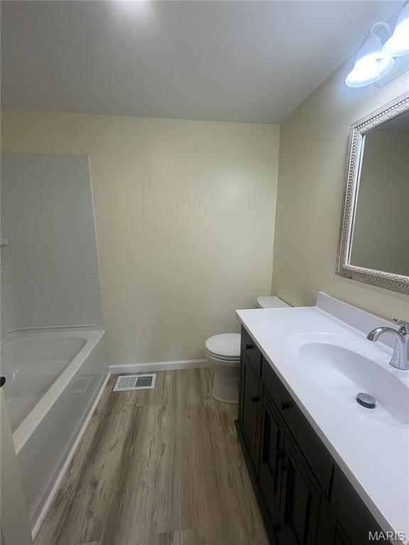252 Trails End Way, Doniphan, MO 63935 - full bathroom with wood finished floors, vanity, and a tub