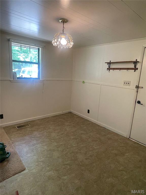 252 Trails End Way, Doniphan, MO 63935 - spare room with a chandelier and tile patterned floors