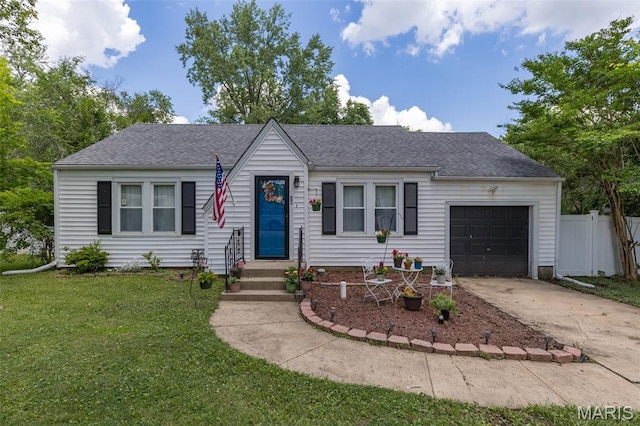39 Pine St, Farmington, MO 63640 - view of front of home with an attached garage, concrete driveway, and a shingled roof