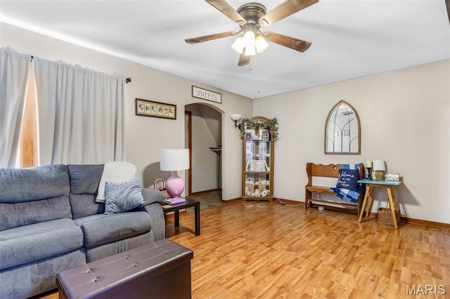 39 Pine St, Farmington, MO 63640 - living area featuring arched walkways, a ceiling fan, and light wood-type flooring