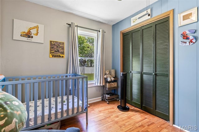39 Pine St, Farmington, MO 63640 - bedroom with a closet, wood finished floors, and a crib