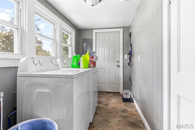 39 Pine St, Farmington, MO 63640 - washroom with washing machine and dryer, stone finish floors, and wood walls