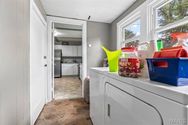39 Pine St, Farmington, MO 63640 - washroom with washer and clothes dryer and stone finish floors