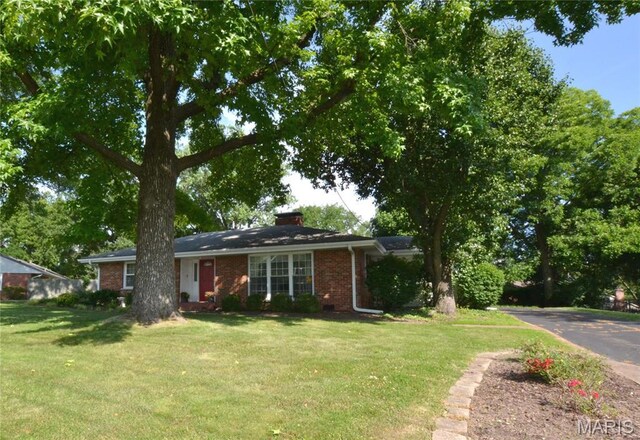 1406 Marshall Rd, Kirkwood, MO 63122 - ranch-style house featuring brick siding, a front lawn, and a chimney