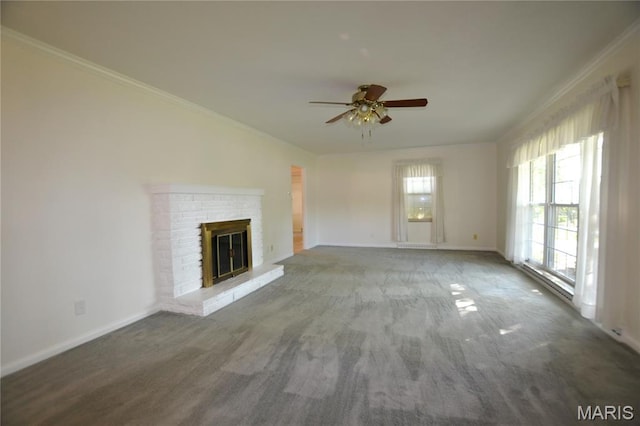 1406 Marshall Rd, Kirkwood, MO 63122 - unfurnished living room featuring ceiling fan, crown molding, a glass covered fireplace, and carpet flooring
