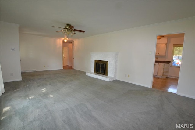 1406 Marshall Rd, Kirkwood, MO 63122 - unfurnished living room with carpet floors, ceiling fan, crown molding, and a fireplace