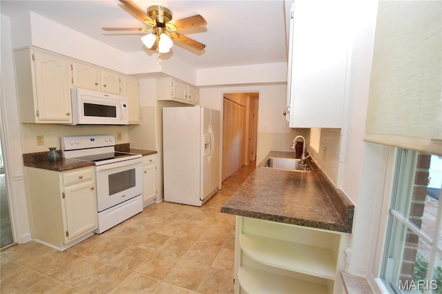 1406 Marshall Rd, Kirkwood, MO 63122 - kitchen with white appliances, dark countertops, tasteful backsplash, ceiling fan, and white cabinetry