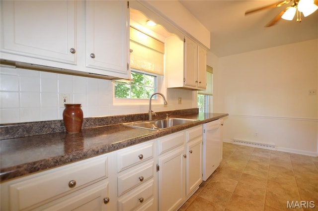 1406 Marshall Rd, Kirkwood, MO 63122 - kitchen with dishwasher, white cabinets, dark countertops, and tasteful backsplash