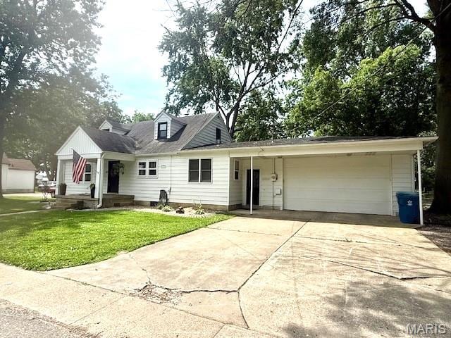902 Sycamore St, Germantown, IL 62245 - view of front of house featuring an attached garage, a front yard, and driveway