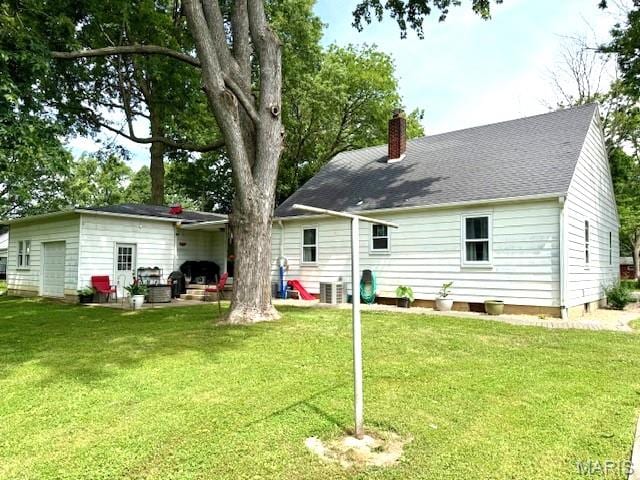 902 Sycamore St, Germantown, IL 62245 - rear view of house featuring a chimney and a yard