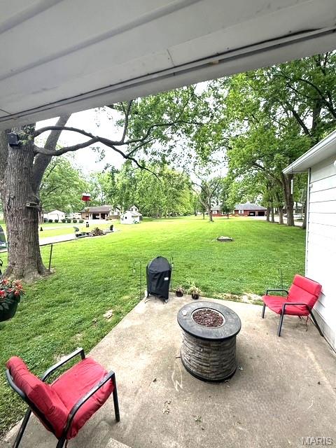 902 Sycamore St, Germantown, IL 62245 - view of patio featuring a fire pit