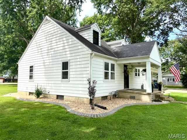 902 Sycamore St, Germantown, IL 62245 - back of house with covered porch, a yard, and a shingled roof