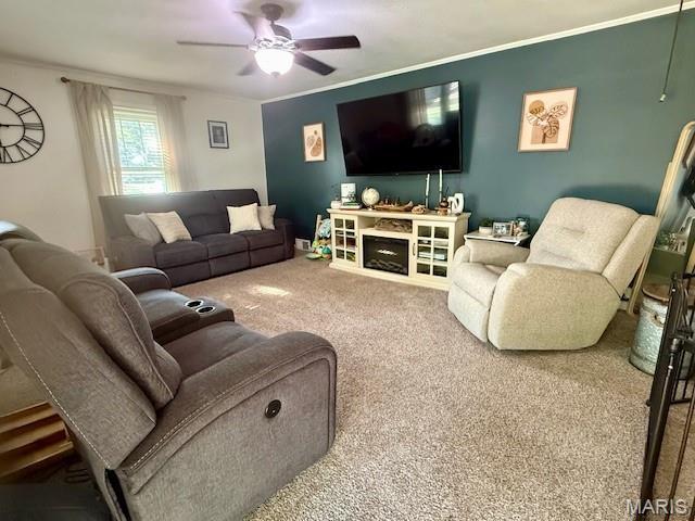 902 Sycamore St, Germantown, IL 62245 - carpeted living area featuring ceiling fan and crown molding