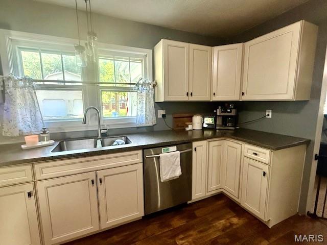 902 Sycamore St, Germantown, IL 62245 - kitchen featuring stainless steel dishwasher, dark wood finished floors, plenty of natural light, and white cabinets