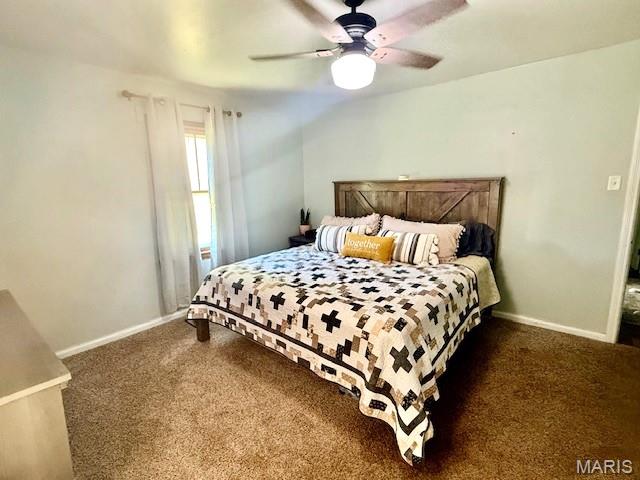 902 Sycamore St, Germantown, IL 62245 - carpeted bedroom with baseboards and a ceiling fan