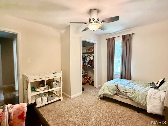 902 Sycamore St, Germantown, IL 62245 - carpeted bedroom featuring a closet and a ceiling fan