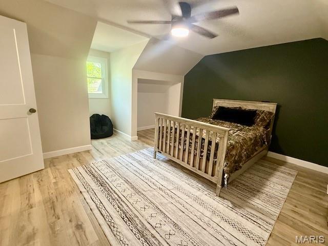 902 Sycamore St, Germantown, IL 62245 - bedroom featuring wood finished floors, vaulted ceiling, and ceiling fan