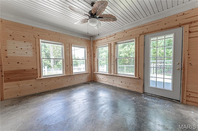 1221 Napoleon Dr, Bonne Terre, MO 63628 - empty room with unfinished concrete floors, wooden walls, and a ceiling fan