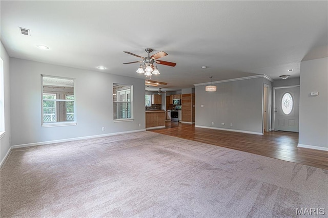 1221 Napoleon Dr, Bonne Terre, MO 63628 - unfurnished living room with carpet, ceiling fan, recessed lighting, and crown molding