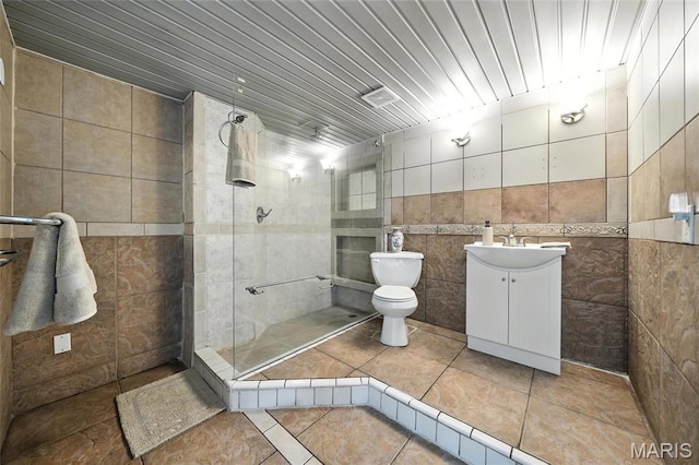 31 Kings Way Dr, Troy, MO 63379 - bathroom featuring tile walls, vanity, a tile shower, and tile patterned flooring