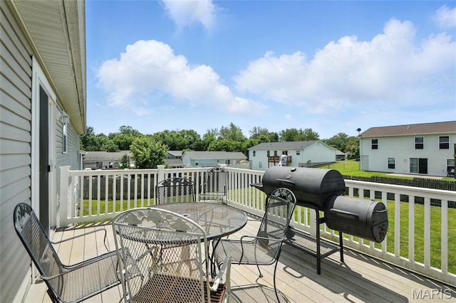 31 Kings Way Dr, Troy, MO 63379 - wooden terrace featuring outdoor dining area, a lawn, and a residential view