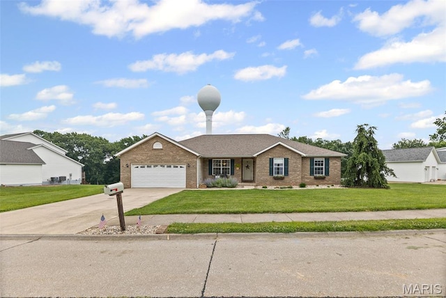 227 W Woodland Rdg, Valmeyer, IL 62295 - single story home with brick siding, driveway, a front yard, and an attached garage