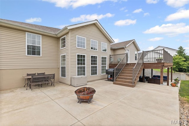227 W Woodland Rdg, Valmeyer, IL 62295 - rear view of house featuring a wooden deck, a patio, an outdoor living space with a fire pit, and stairs