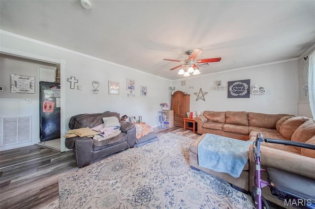 532 Christine St, St James, MO 65559 - living room featuring wood finished floors, ceiling fan, and ornamental molding