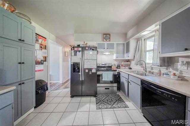 532 Christine St, St James, MO 65559 - kitchen with appliances with stainless steel finishes, under cabinet range hood, light tile patterned floors, and light countertops