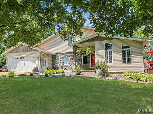 360 David Dr, Washington, MO 63090 - view of front of home with a front yard, a garage, and board and batten siding